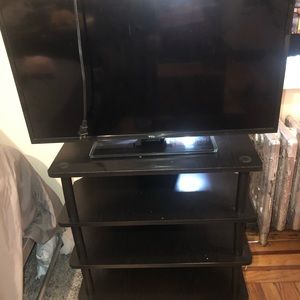 32 inch Roku Smart TV with 3 tier stand